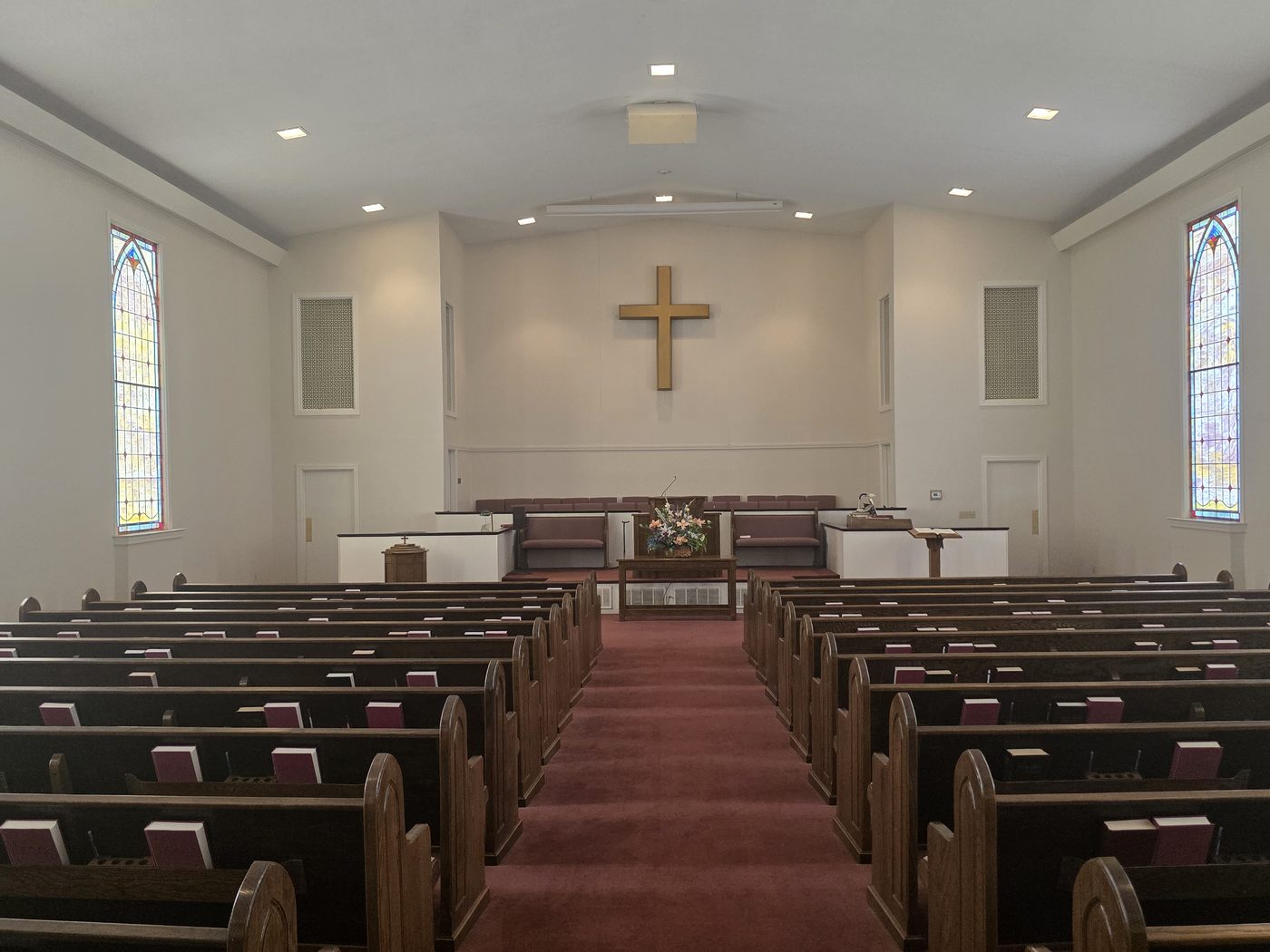 Looking down the center aisle toward the pulpit and cross at Norris Hill